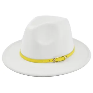 Detail of white felt fedora hat featuring a bright yellow leather belt with golden buckle