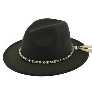 Close-up of fedora hat with gold chain, pearls and white tassels on felt brim