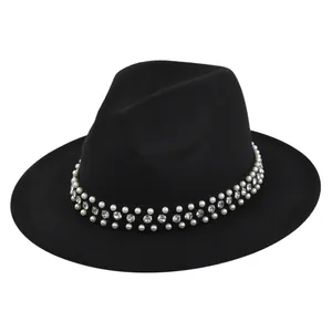 Close-up of elegant pearl and rhinestone band on high-quality black felt fedora hat