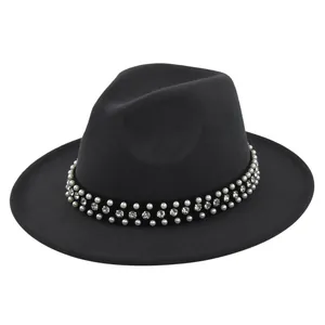 Detail of black wool fedora featuring two rows of pearls and a rhinestone band