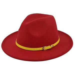 Detailed shot of red wool felt fedora featuring a bright yellow leather band with silver buckle