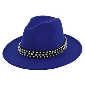 Detail of royal blue wool fedora hat featuring rhinestone and faux pearl band decoration
