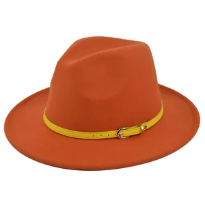 Close-up of orange wool fedora featuring a bright yellow belt with gold metal buckle