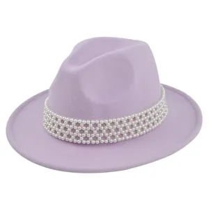 Detailed close-up of lavender wool felt fedora featuring a luxury pearl bead hat band