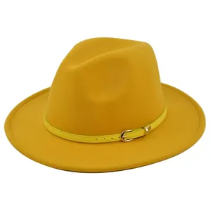 Detailed view of yellow wool fedora hat with thin leather belt and gold buckle