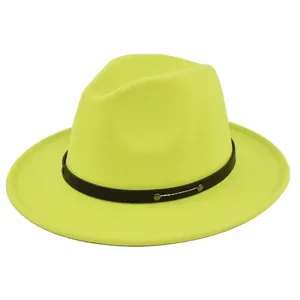 Detail of neon yellow wool fedora hat with black leather belt and metal rivet accents