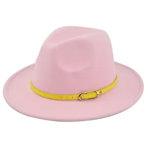 Detailed view of pink wool fedora hat featuring a bright yellow belt with gold buckle