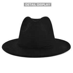 Detail display of black wool felt fedora showing crown stitching and smooth texture