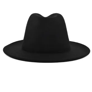 Macro detail of high quality black wool felt fedora showing thick texture and wide brim