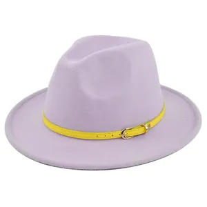 Detail of lavender wool fedora hat featuring a bright yellow faux leather belt band decoration