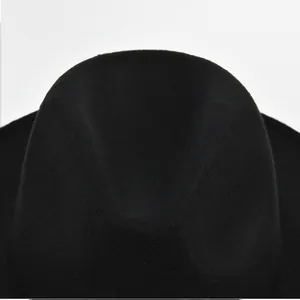 Detailed macro view of the black felt crown and indentation on this classic fedora hat
