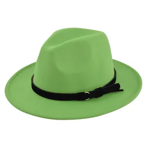 Macro view of bright green felt fedora featuring black leather band and gold metal ring