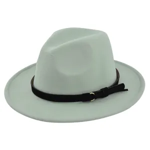 Detail of mint green fedora hat featuring a black belt with gold buckle and tassel