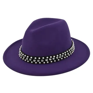 Close-up of purple fedora hat with elegant pearl and rhinestone decorative hatband