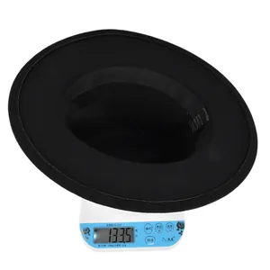 Weight measurement of black wool felt fedora hat showing 133.5g on electronic scale