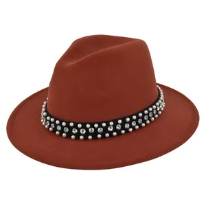 Detailed close-up of wool fedora with white pearls and sparkling rhinestone band