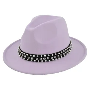 Detail of lavender fedora hat featuring black band with rows of white pearls and rhinestones