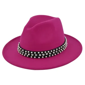 Detail of rose red fedora with black satin band featuring pearls and rhinestones