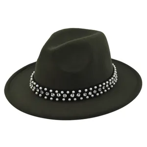 Detail of dark green wool fedora featuring pearl and rhinestone studded velvet band