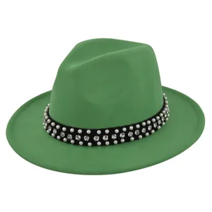 Detail of green wool fedora hat featuring black ribbon with pearls and rhinestones