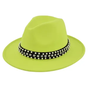 Detail of neon green wool fedora hat featuring black band with pearls and rhinestones