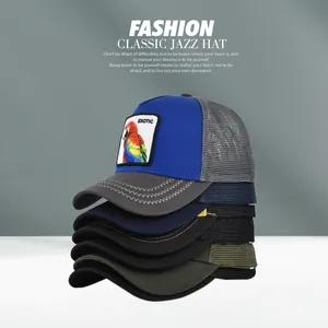 Close-up of stacked mesh trucker hats with exotic parrot embroidery and multi-color options