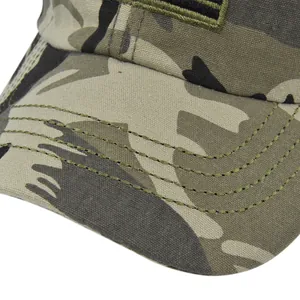 Detailed close-up of reinforced stitching on the brim of a camouflage baseball cap