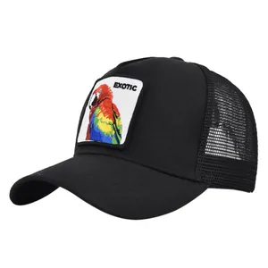 Detailed close-up of parrot embroidery patch on black mesh trucker baseball hat