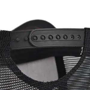 Close-up of the adjustable plastic snapback buckle and mesh back on the black trucker hat