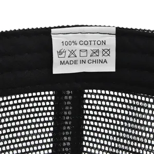 Detail view of cotton baseball cap inner wash label showing 100 percent cotton material