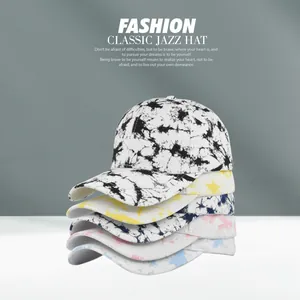 Detailed stack of five colorful tie-dye cotton baseball caps in various pastel shades