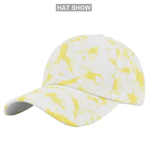 Detailed close-up of yellow and white tie-dye fabric texture on a canvas baseball cap
