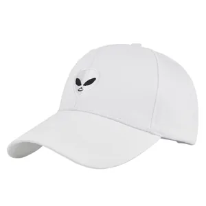 Detailed close-up of the white alien face embroidery on this cotton baseball cap