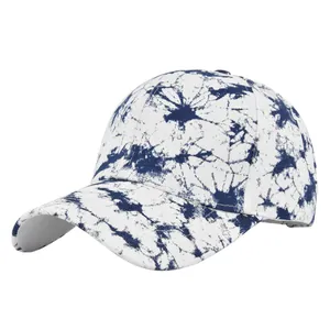 Detail view of tie-dye baseball cap with blue and white marble pattern texture