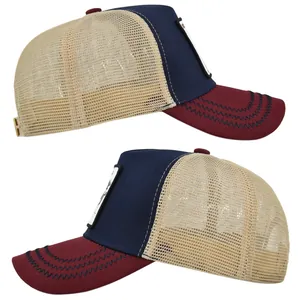 Detail view of trucker hat featuring deer embroidery and breathable mesh panels