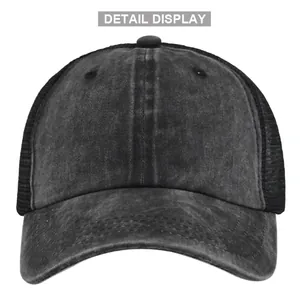 Detail display of the black vintage trucker hat with washed denim front and breathable mesh