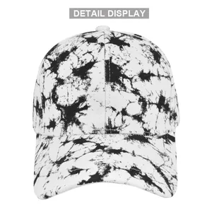 Close-up of black and white tie-dye ink pattern and stitching on a baseball cap