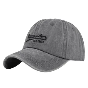 Detailed close-up of charcoal grey washed cotton baseball cap with Rudolfs embroidery