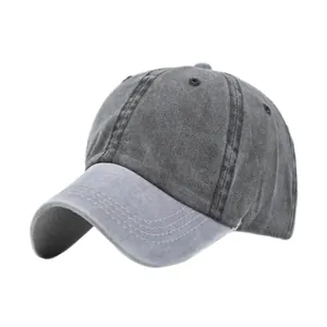 Vue détaillée d'une casquette de baseball vintage grise montrant les coutures et la texture