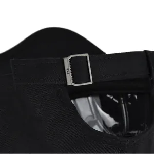 Detail of adjustable metal buckle on black alien embroidery baseball cap with 17.8 engraving