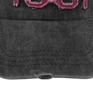 Detailed close-up of vintage distressed grey cotton baseball cap with 1981 embroidery