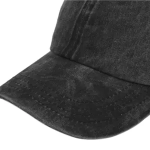 Close-up of charcoal wash cotton baseball cap showing detailed reinforced stitching on the brim