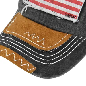 Dettaglio del cappello vintage con ricamo bandiera USA e cuciture effetto invecchiato