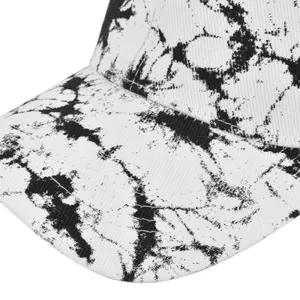 Detailed macro view of tie-dye baseball cap with black marble pattern and reinforced stitching