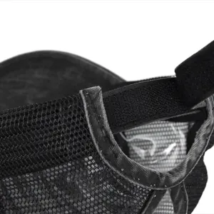 Detail of black mesh ponytail cap featuring breathable fabric and adjustable velcro closure