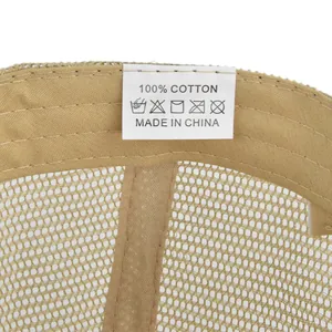 Detail of the 100% cotton wash label and internal mesh stitching on the khaki baseball cap