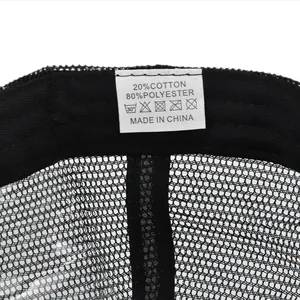 Detail view of cotton-polyester blend care label and mesh texture on a ponytail sun hat