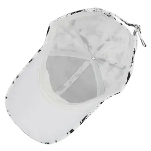Detail view showing the breathable white lining and adjustable strap of the tie-dye cap