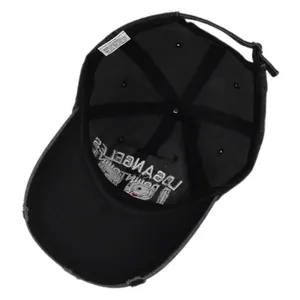 Detail view of cotton baseball cap interior with sweatband and distressed metal buckle
