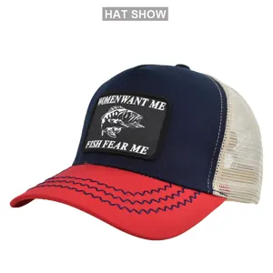 Detail of blue and red trucker hat featuring fish patch and breathable cream mesh